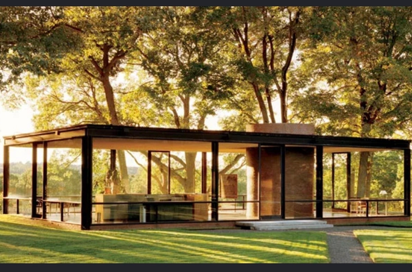 Philip Johnson's Glass House in New Canaan, Connecticut, its glass walls set among mature trees.